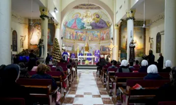 Christian Palestinians Attend Christmas Eve Mass at Church in Gaza City where They Seek Shelter